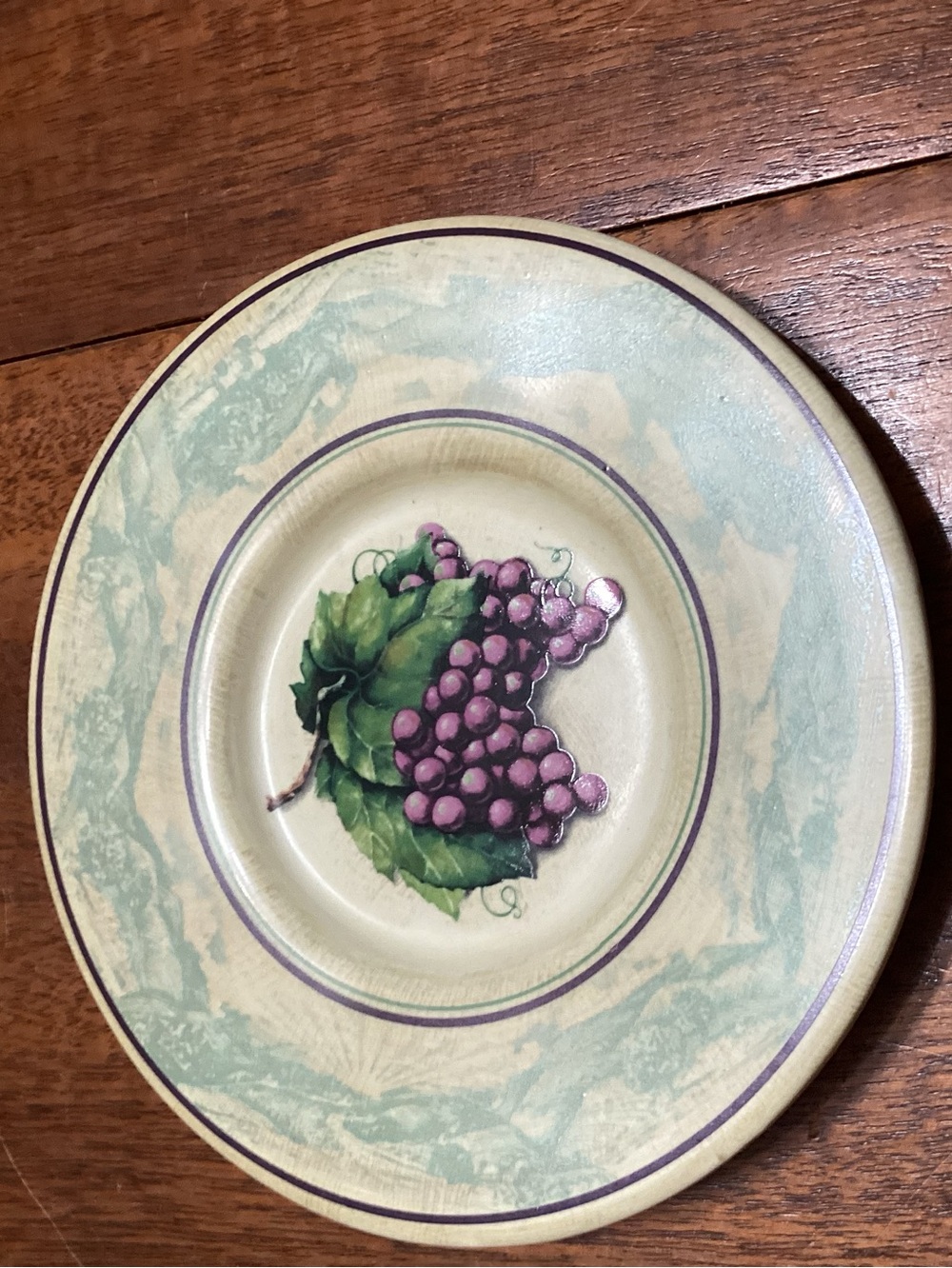 Decorative Ceramic Plate with Purple Grape Motif and Green Leaves